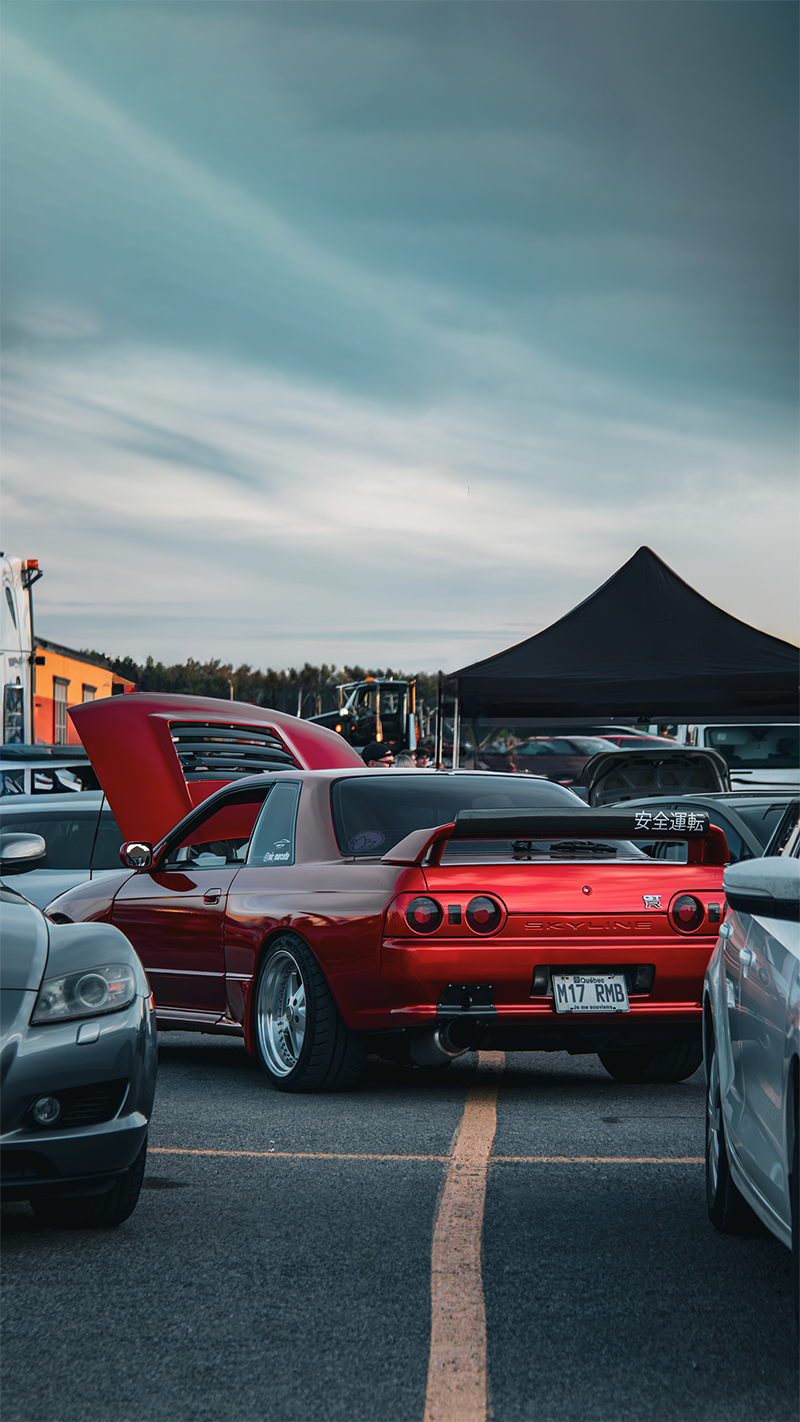 Photo of a Red Nissan Skyline R32 GTR in a festival